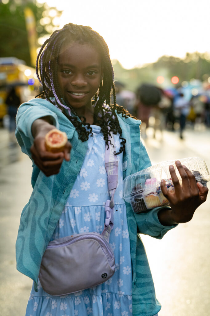 young girl with food